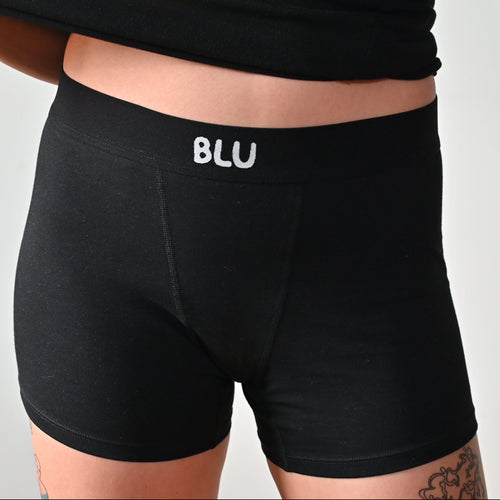 a women wearing a short version of boxer shorts of blu 