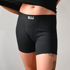a women wearing blu long version of boxershorts